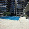 Apartament modern cu balcon generos și acces la piscină thumb 11