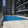 Apartament modern cu balcon generos și acces la piscină thumb 20